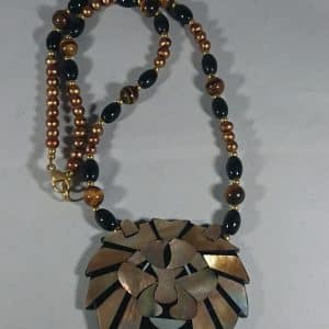 Vintage Lion pendant on bead necklace.