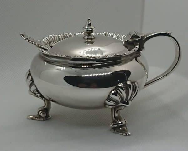 Solid silver mustard pot with spoon and blue glass liner