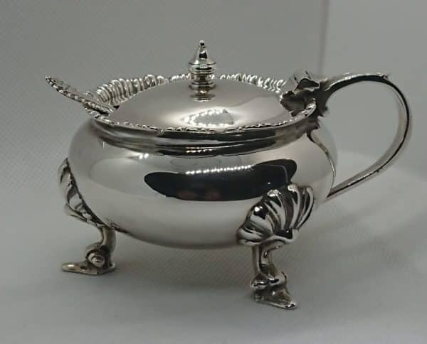 Solid silver mustard pot with spoon and blue glass liner