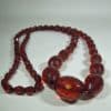 Long Faceted Cherry Amber Beads