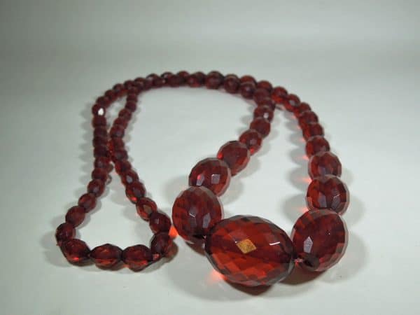 Long Faceted Cherry Amber Beads