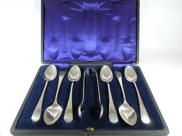 Silver Teaspoons and sugar tongs